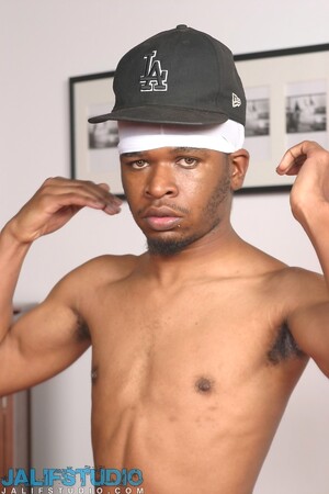 Short ebony gay dude R Devil strips and touches his huge hairy black dick