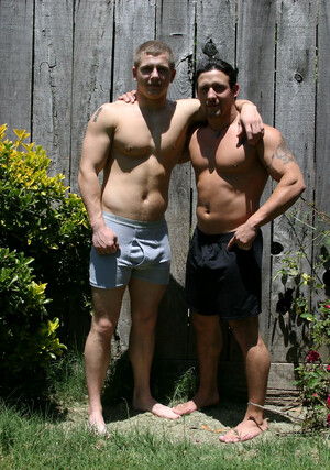 Muscular gay studs Tommy D & Hoyce flaunting their mighty chests outdoors