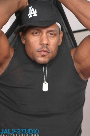 Hot gay ebony Aron Ridge unveils his muscular body and big black dick